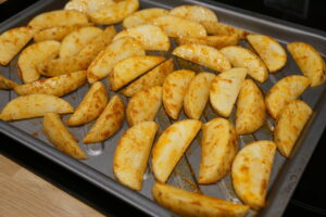 potato wedges on baking tray