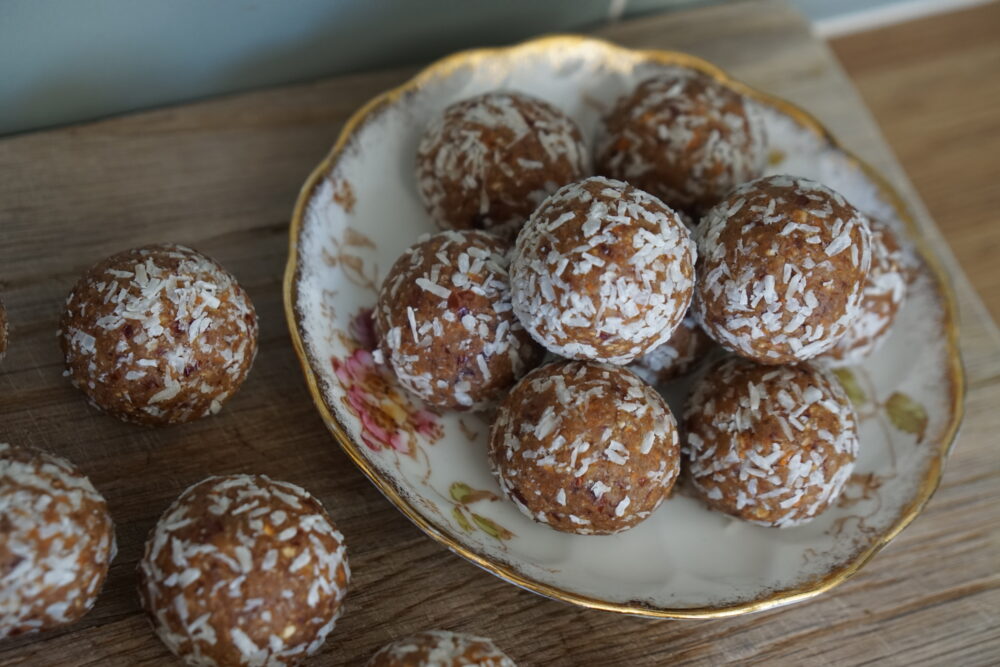 coconut-covered carrot balls on a plate