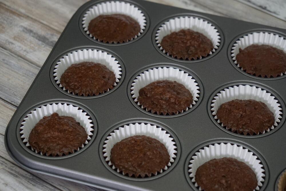 cake batter in cupcake cases