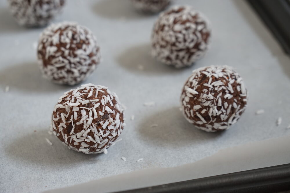 coconut protein balls in coconut