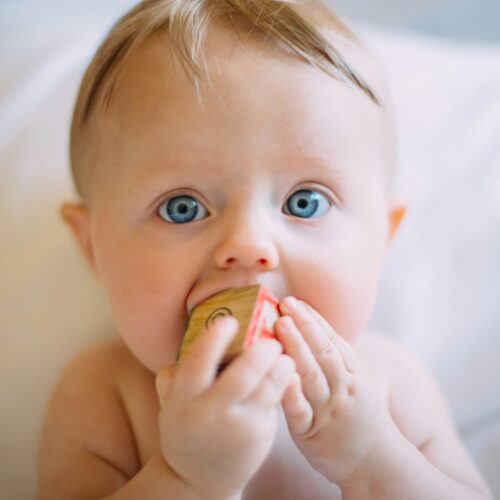 child with a block